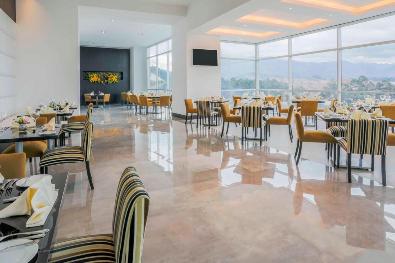 โฟร์พอยต์ บาย เชอราตัน เกวนกา Hotel กูเอ็งกา ภายนอก รูปภาพ The restaurant