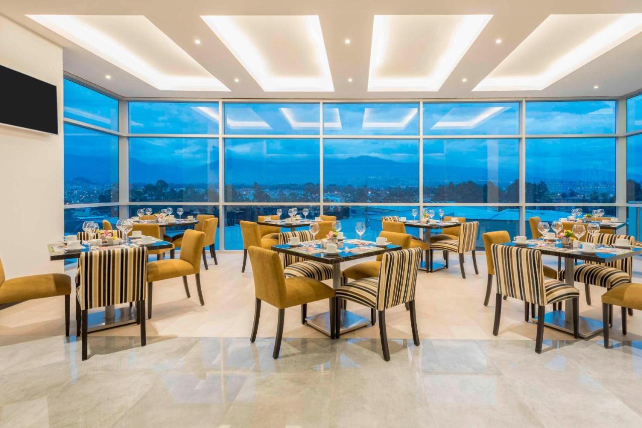 โฟร์พอยต์ บาย เชอราตัน เกวนกา Hotel กูเอ็งกา ภายนอก รูปภาพ The restaurant